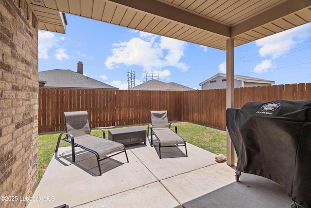 6827 38th St, Lubbock, TX 79407 - fenced backyard with a patio area and a grill