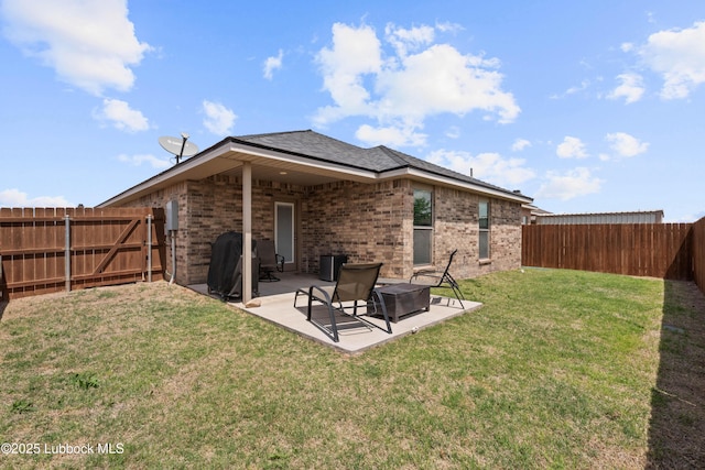 6827 38th St, Lubbock, TX 79407 - back of property with brick siding and a patio