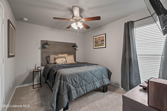 6827 38th St, Lubbock, TX 79407 - carpeted bedroom with baseboards and ceiling fan