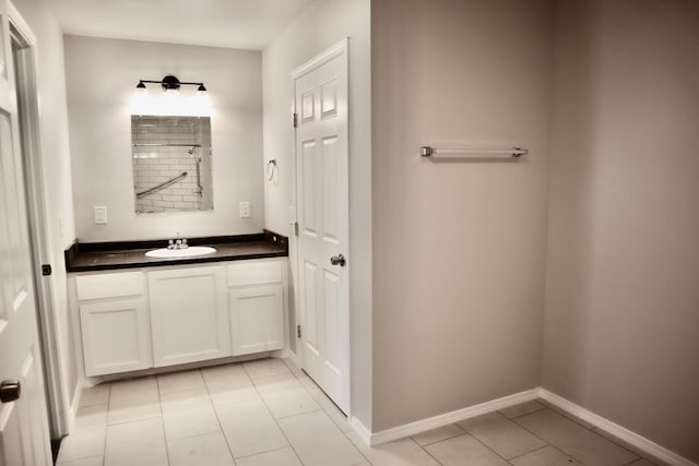 bathroom with vanity and tile patterned flooring