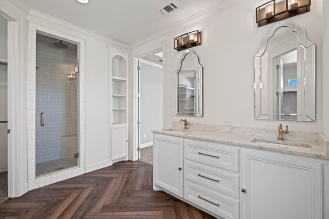 bathroom featuring crown molding, parquet floors, vanity, and a shower with shower door