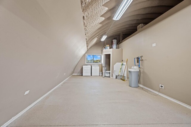 unfurnished living room featuring lofted ceiling and carpet flooring