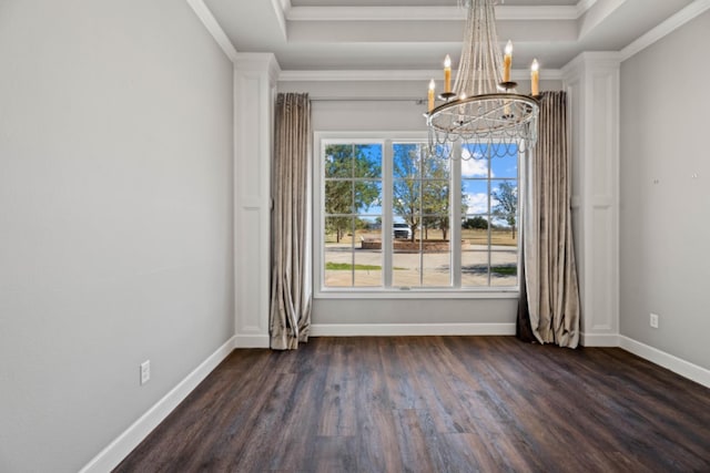 unfurnished dining area featuring dark hardwood / wood-style flooring, a notable chandelier, ornamental molding, and a raised ceiling