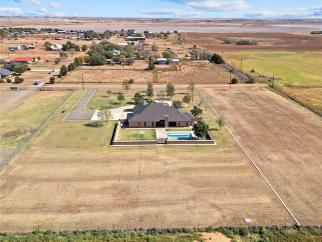 birds eye view of property with a rural view