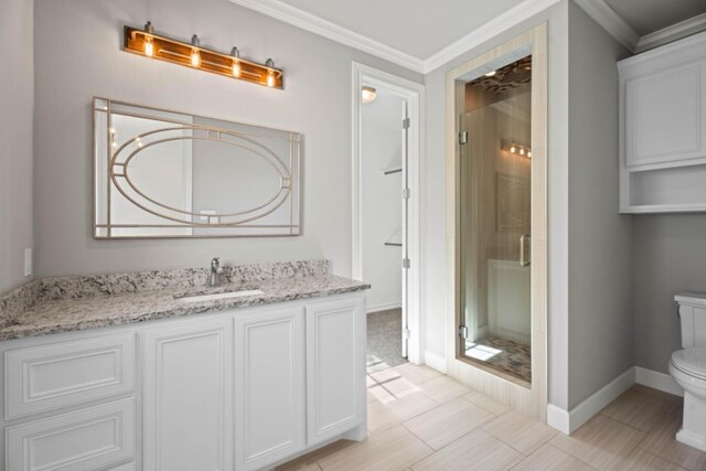 bathroom with walk in shower, vanity, crown molding, and toilet