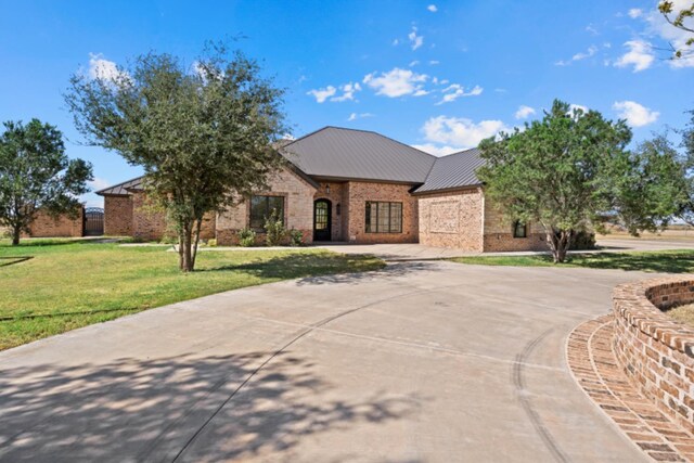 french country home featuring a front yard