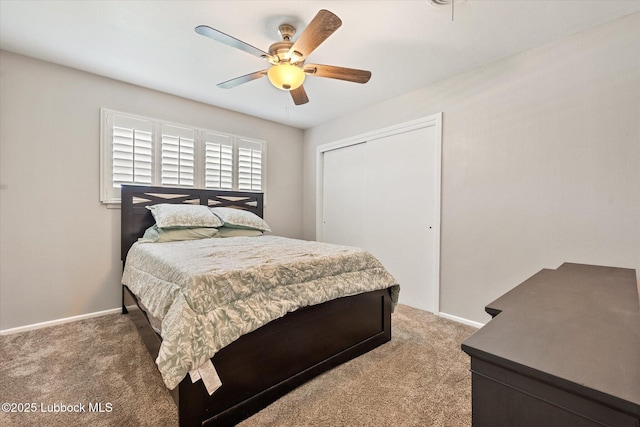 2141 71st St, Lubbock, TX 79412 - bedroom with light carpet, a closet, and a ceiling fan