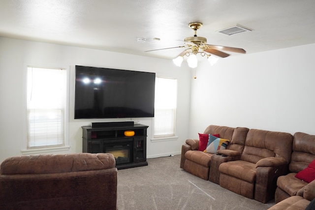 2007 25th St, Lubbock, TX 79411 - carpeted living area featuring a ceiling fan and baseboards