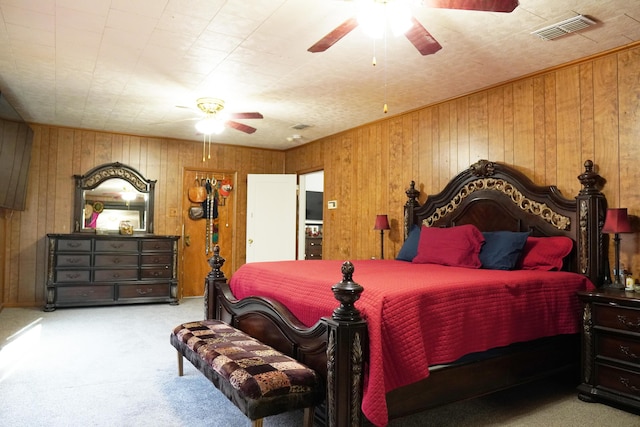 2007 25th St, Lubbock, TX 79411 - carpeted bedroom with wooden walls and ceiling fan