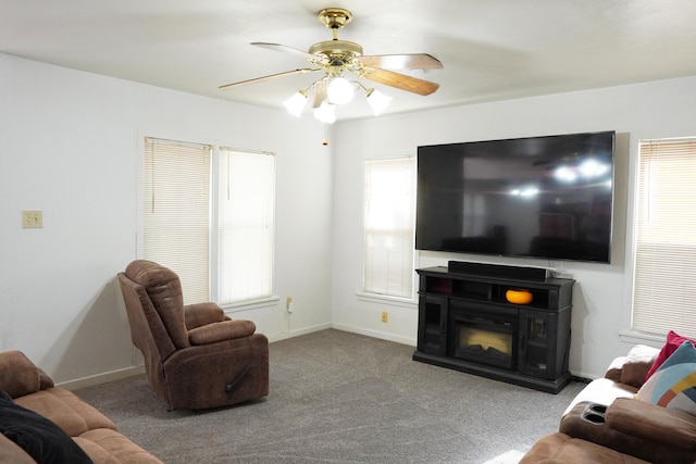 2007 25th St, Lubbock, TX 79411 - carpeted living area featuring ceiling fan and baseboards