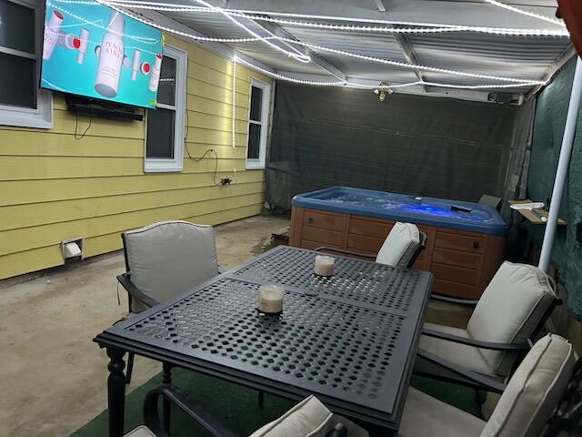 2007 25th St, Lubbock, TX 79411 - view of patio / terrace with a hot tub and outdoor dining space