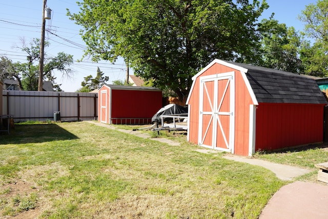 2007 25th St, Lubbock, TX 79411 - view of yard featuring a storage unit and an outbuilding