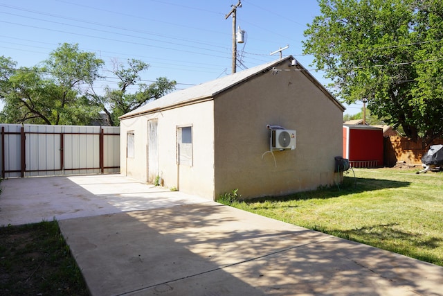 2007 25th St, Lubbock, TX 79411 - view of property exterior featuring a patio, stucco siding, a cooling unit, and an outdoor structure