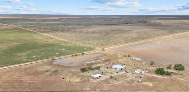 birds eye view of property with a rural view