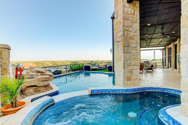 view of pool featuring a patio and ceiling fan