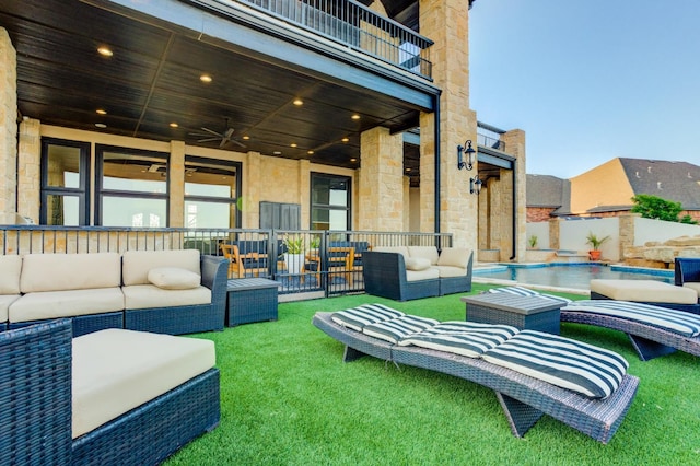 view of patio with ceiling fan, an outdoor hangout area, and a balcony