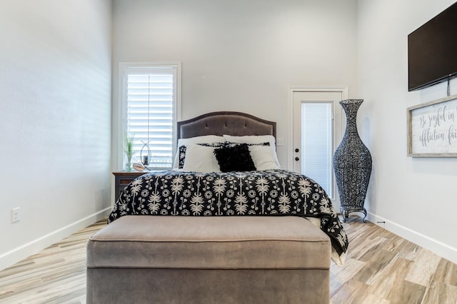 bedroom with light hardwood / wood-style flooring