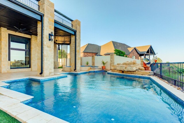 view of swimming pool with ceiling fan