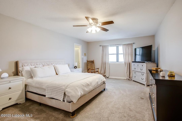2912 76th St, Lubbock, TX 79423 - carpeted bedroom with ceiling fan and baseboards