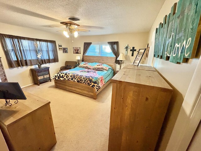 819 N Amherst Hwy, Earth, TX 79031 - bedroom with ceiling fan, carpet floors, and a textured ceiling