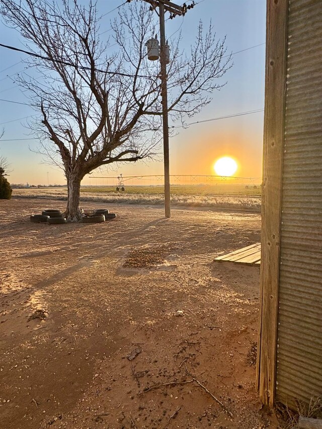 819 N Amherst Hwy, Earth, TX 79031 - view of yard at dusk
