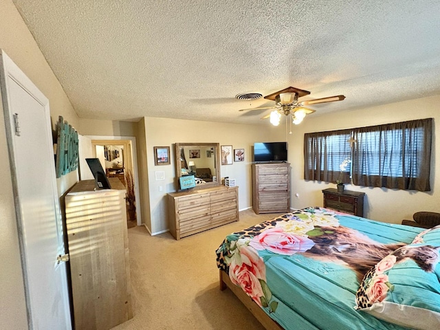 819 N Amherst Hwy, Earth, TX 79031 - carpeted bedroom with a textured ceiling and ceiling fan