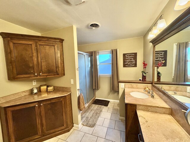 819 N Amherst Hwy, Earth, TX 79031 - bathroom featuring walk in shower, tile patterned floors, and vanity