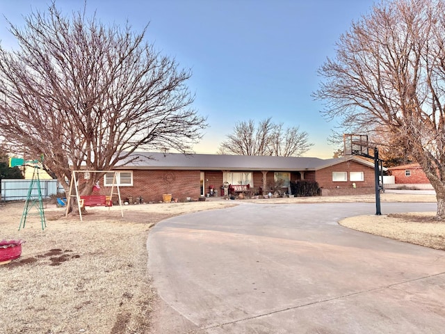 819 N Amherst Hwy, Earth, TX 79031 - view of front facade featuring a playground
