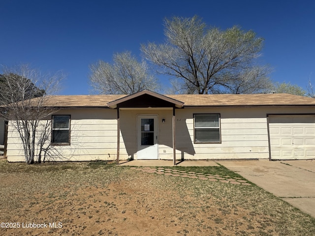 6210 22nd St, Lubbock, TX 79407 - ranch-style home featuring an attached garage and concrete driveway