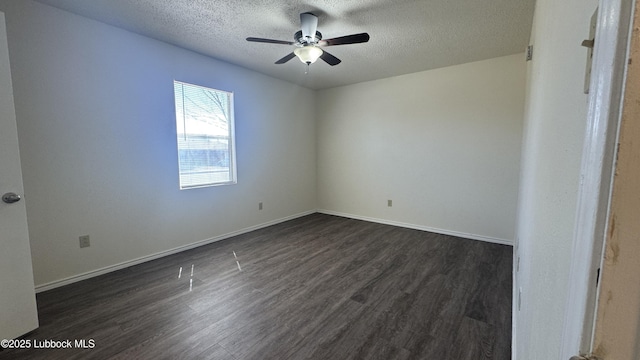 6210 22nd St, Lubbock, TX 79407 - empty room featuring a textured ceiling, dark wood-style floors, ceiling fan, and baseboards