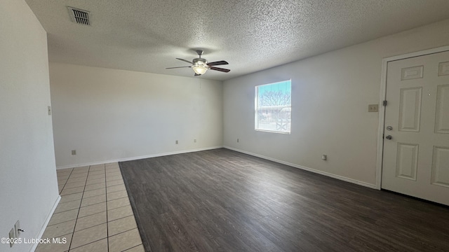 6210 22nd St, Lubbock, TX 79407 - unfurnished room featuring ceiling fan, light wood-style flooring, a textured ceiling, and baseboards