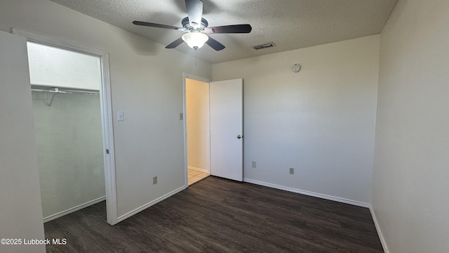6210 22nd St, Lubbock, TX 79407 - unfurnished bedroom featuring wood finished floors, a textured ceiling, baseboards, a closet, and ceiling fan