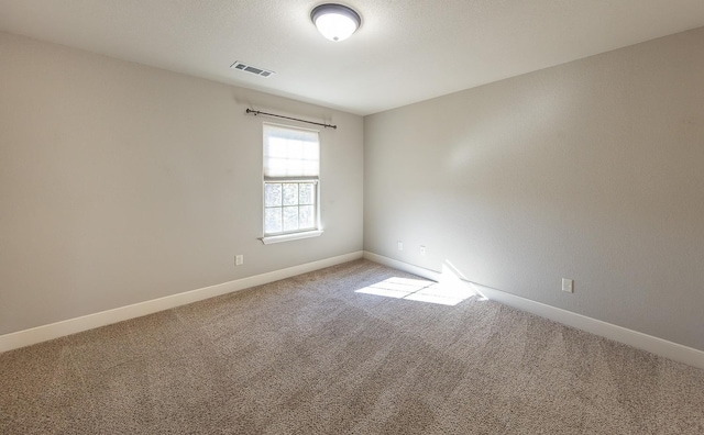 spare room featuring carpet floors