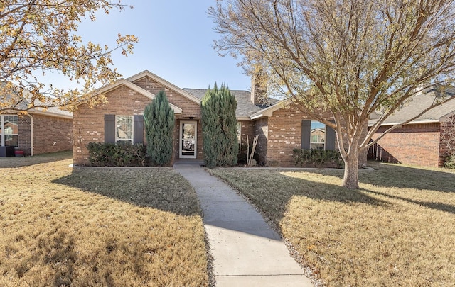 single story home with a front yard