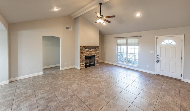 unfurnished living room featuring light tile patterned floors, a stone fireplace, lofted ceiling with beams, and ceiling fan