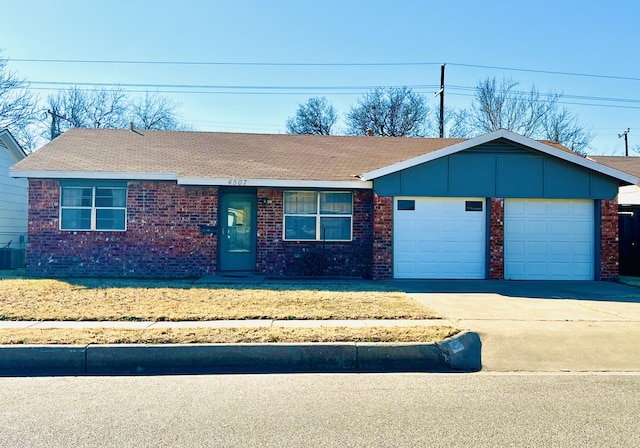 single story home with cooling unit and a garage