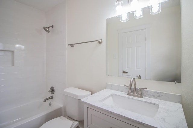 full bathroom with tiled shower / bath combo, vanity, and toilet