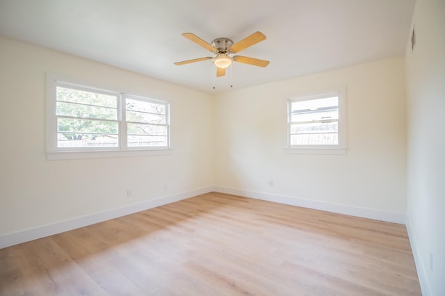 spare room featuring ceiling fan and light hardwood / wood-style flooring