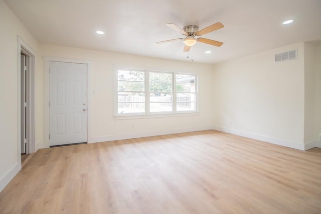 spare room with ceiling fan and light hardwood / wood-style flooring