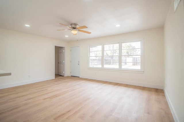 empty room featuring light hardwood / wood-style floors and ceiling fan