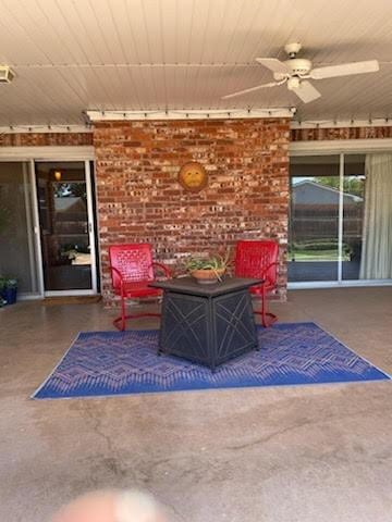 view of patio featuring ceiling fan