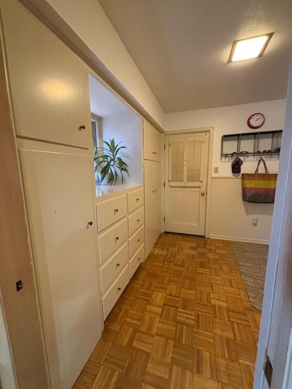 hallway featuring light parquet floors