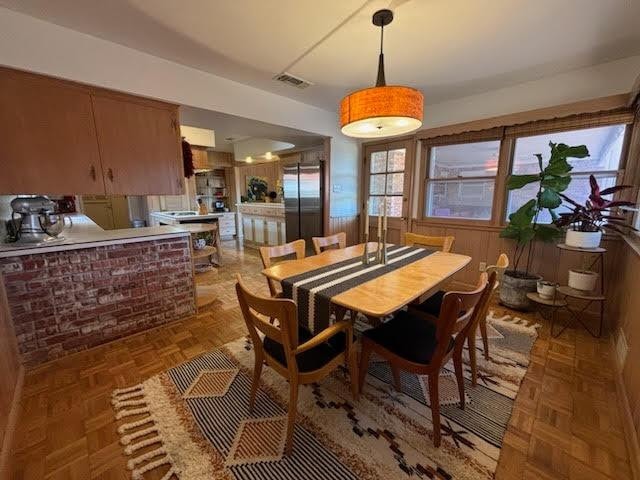 dining room with parquet flooring