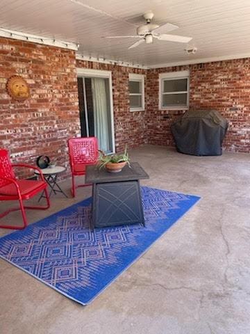 view of patio / terrace with grilling area and ceiling fan