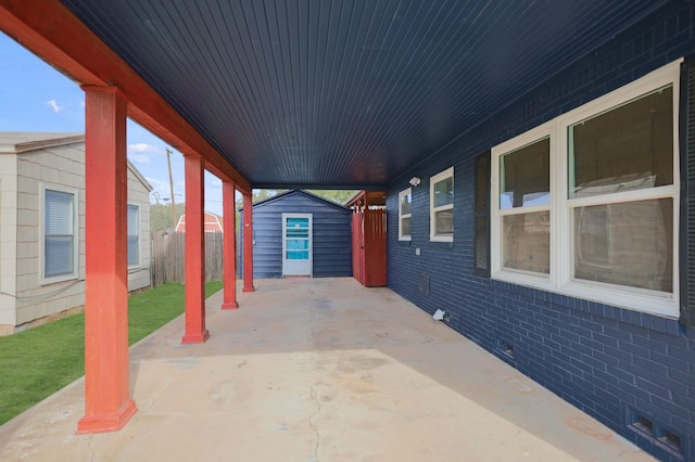 view of patio / terrace with a shed