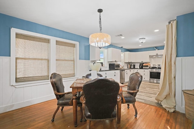 dining room with wood-type flooring