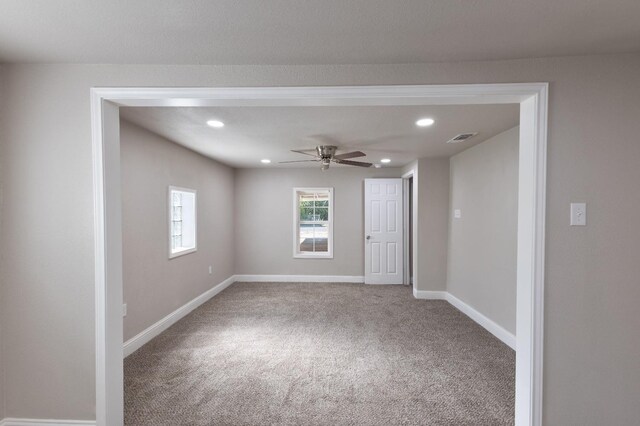 carpeted empty room with ceiling fan