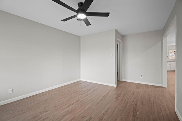 spare room featuring ceiling fan and wood-type flooring