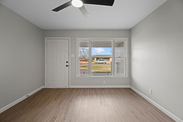 spare room featuring ceiling fan and wood-type flooring