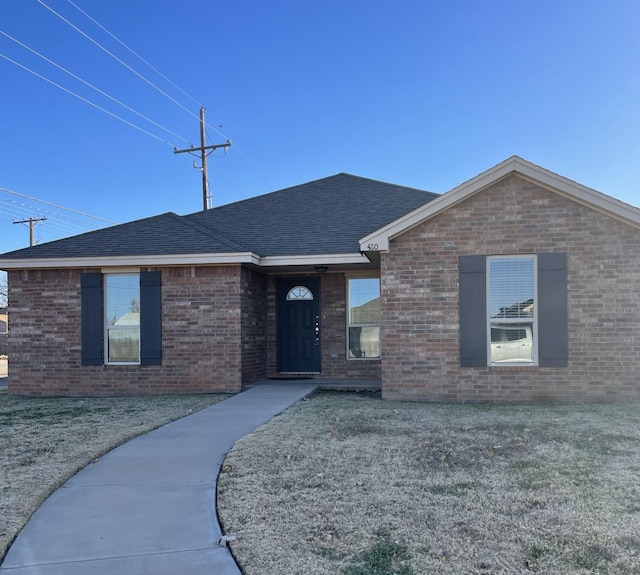 single story home with a front yard